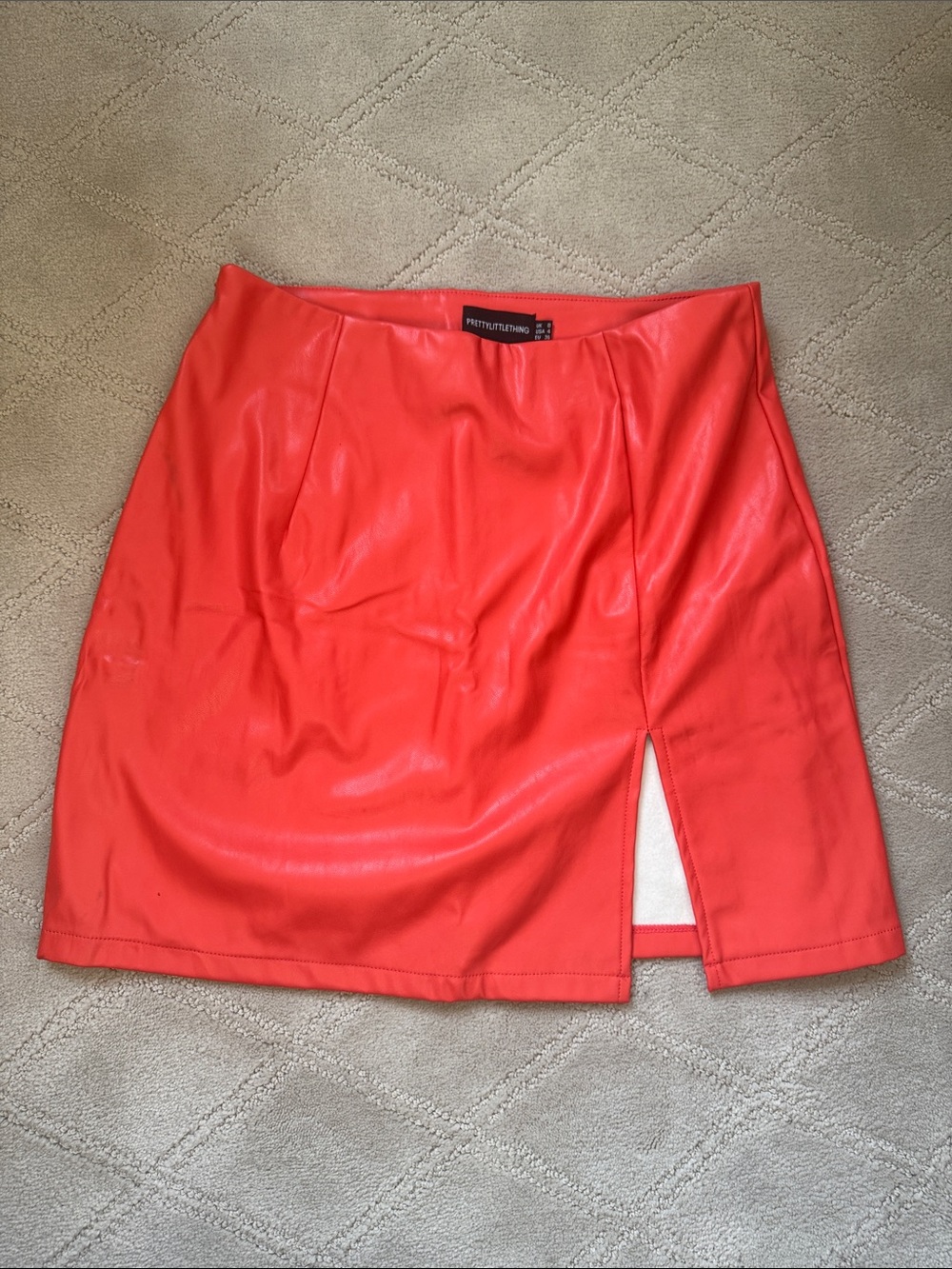 PrettyLittleThing Coral-Red Faux Leather Mini Skirt with Side Slit